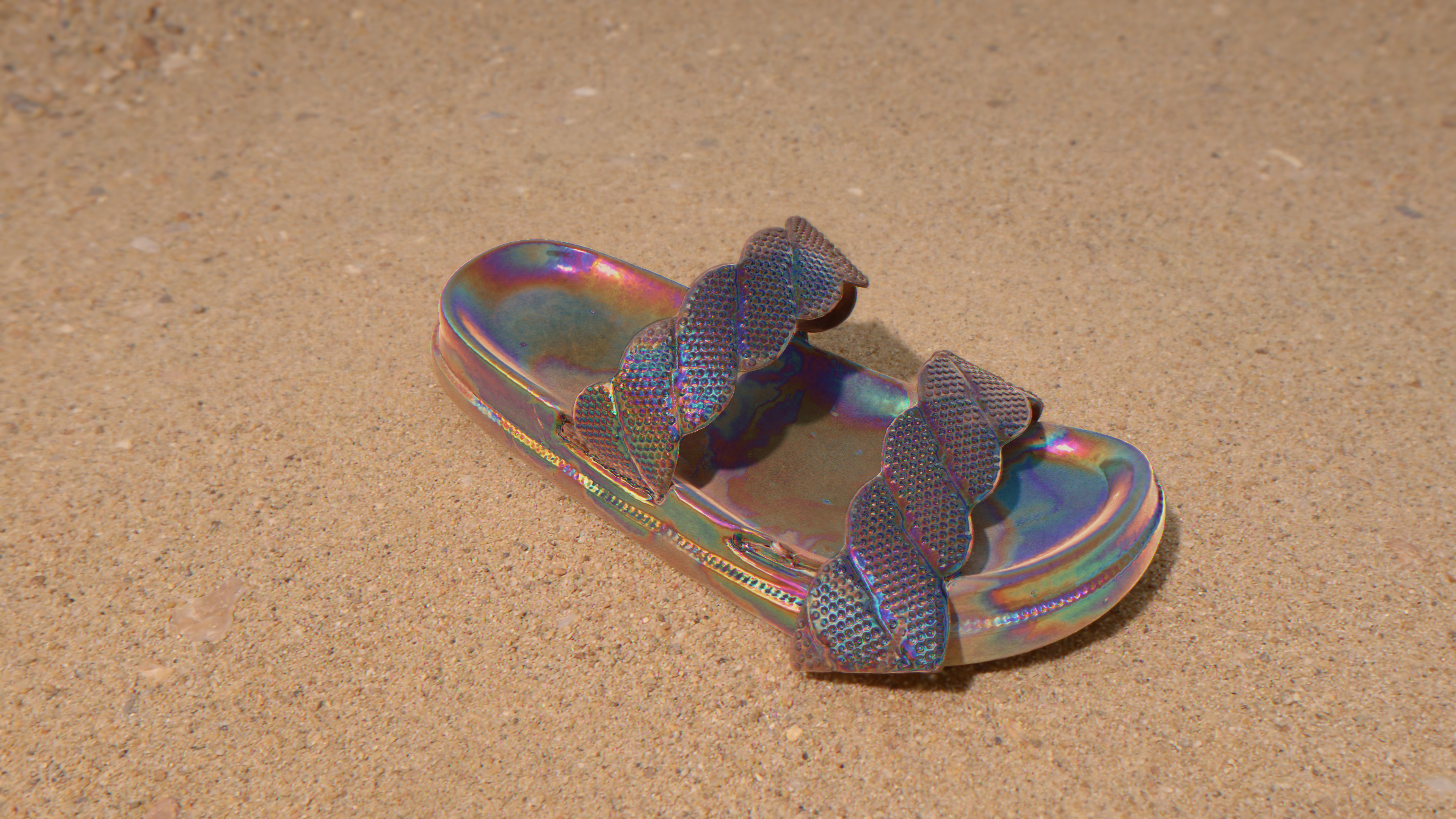 Lone fluorescent sandal with double shoe straps in a barren desert landscape 
