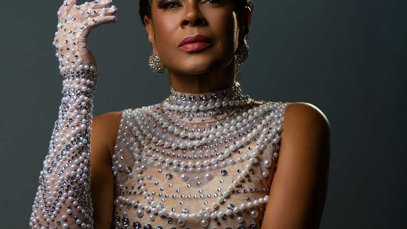 Woman in evening gown with pearls