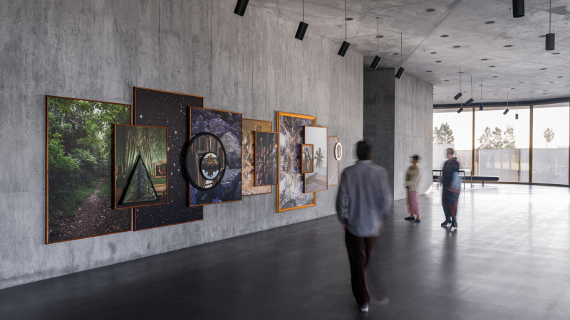 Photo of people and artwork in gallery