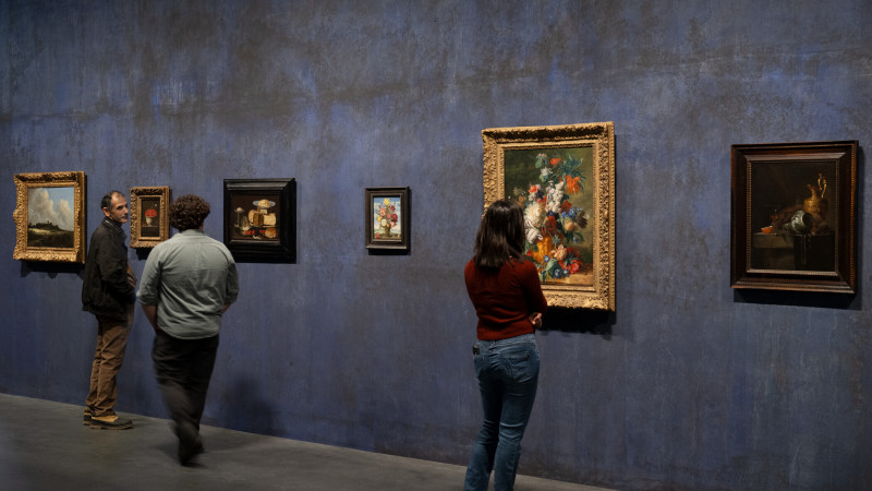 Photo of people and artwork in gallery