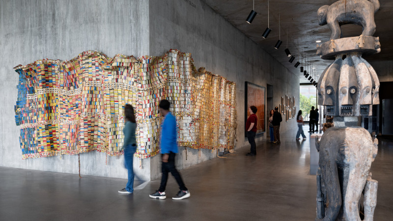 Photo of visitors and artworks in gallery