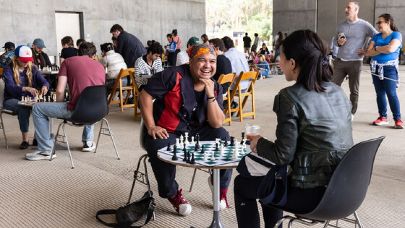 Photo of people playing chess at tables