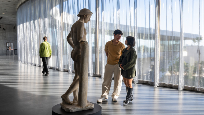 Visitors in the David Geffen Galleries with The Bateman Mercury, Roman, 2nd-century copy after a Greek original of the 4th century BCE., Los Angeles County Museum of Art, William Randolph Hearst Collection, photo © Museum Associates/LACMA, by Charlie Powers