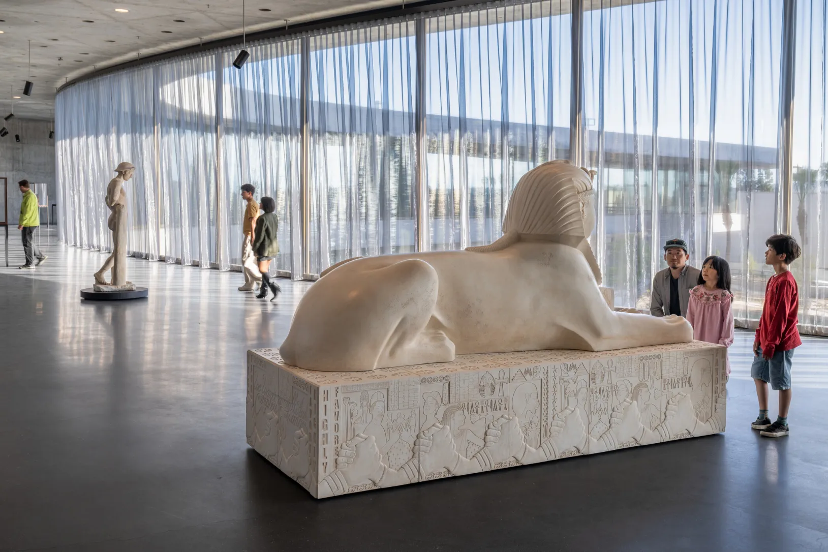 <p>Visitors in the David Geffen Galleries at LACMA featuring Lauren Halsey, <em>Untitled</em>, 2026, Los Angeles County Museum of Art, purchased with funds provided by the Blanchard Nesbitt family, © Lauren Halsey, photo © Museum Associates/LACMA, by Charlie Powers</p>