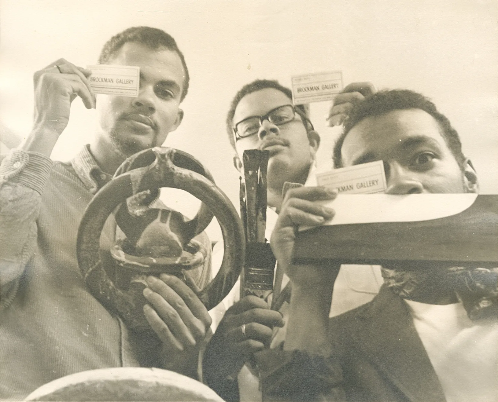 <p><em>Dale Brockman Davis, Alonzo Davis, and David Hammons with Brockman Gallery wall labels</em>, c. 1968–71, Alonzo Davis Collection, MS07, Box 26, Folder 4. The Driskell Center at the University of Maryland, College Park, gift of the Artist</p>
